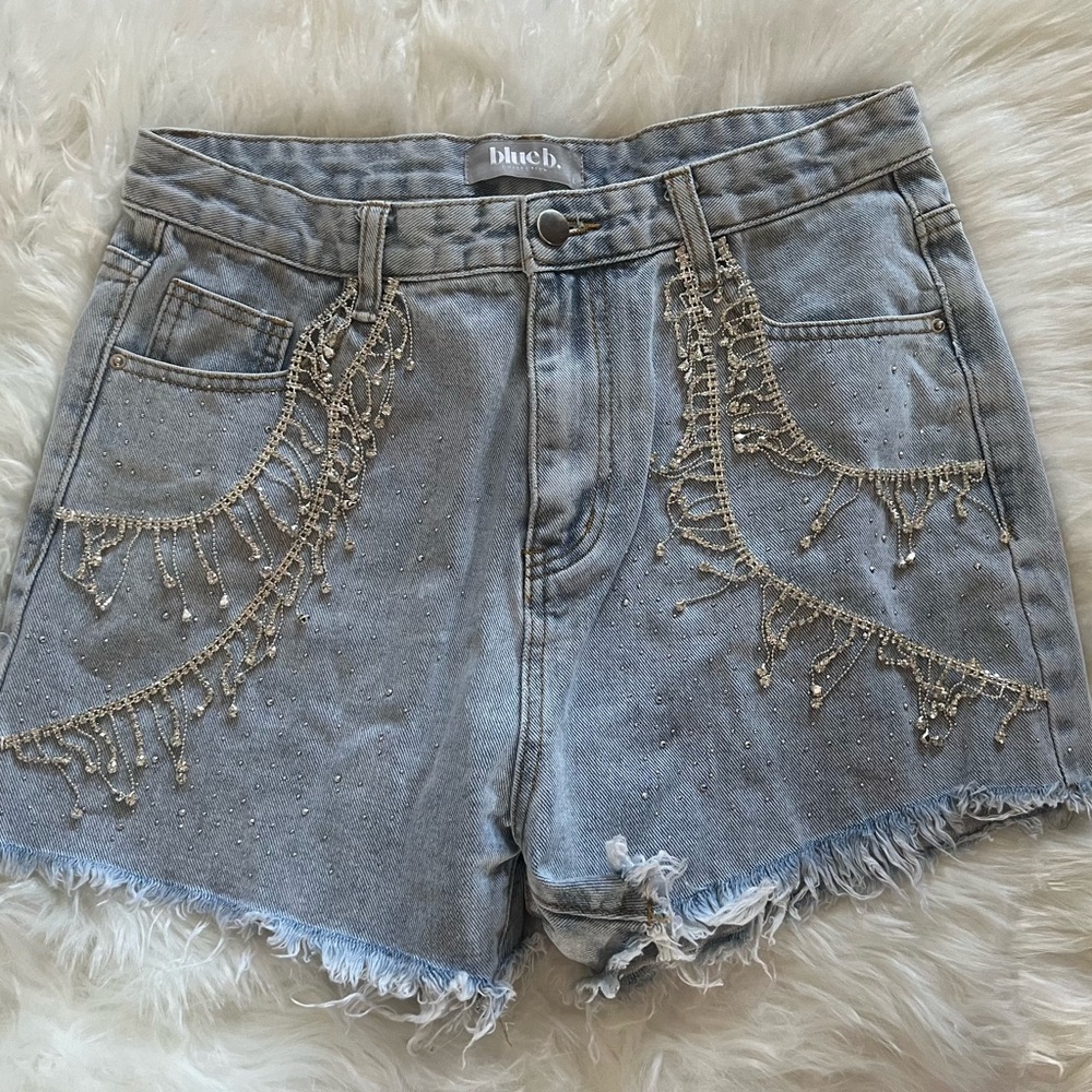 Buckle Blueb. Never worn Size L Jean short with rhinestones intact.